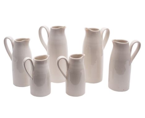 *Hilary Roberts [b.1962] a graduating set of six porcelain jugs: of tapering cylinder form with strap handles and pinched spo