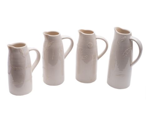 *Hilary Roberts [b.1962] a graduating set of four porcelain jugs: of tapering cylinder form with strap handles and pinched sp
