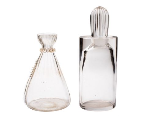 A clear glass decanter and a carafe: the form of Scandinavian influence and of oval profile with pouring lip and a fluted lem
