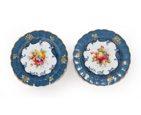 A pair of Royal Worcester dishes with a crimped edge, blue and gilt decoration with fruit 1925 signed E.Philips, diameter 21c