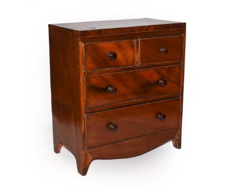 A 19th century miniature apprentice made mahogany chest of drawers, straight fronted, two short over two long drawers over br