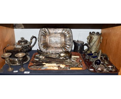 Various silver plated wares including bottle stand, teapot, condiments, flatware etc (one shelf)