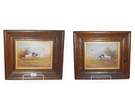 A pair of 20th century Crown Devon fielding porcelain plaque painted with scenes of gun dogs in landscapes, signed R.Hinton. 