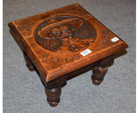 Boer war interest; a carved oak stool commemorating the end of the seige of Mafeking (Mahikeng) May 17th,1900, with a portrai