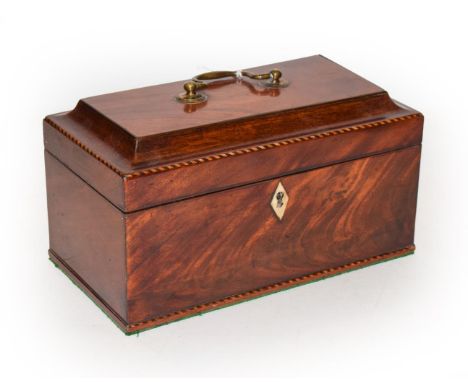 A George III mahogany and string inlaid tea caddy enclosing three Pewter Liddon canisters 24cm by 13cm.  Light surface scratc