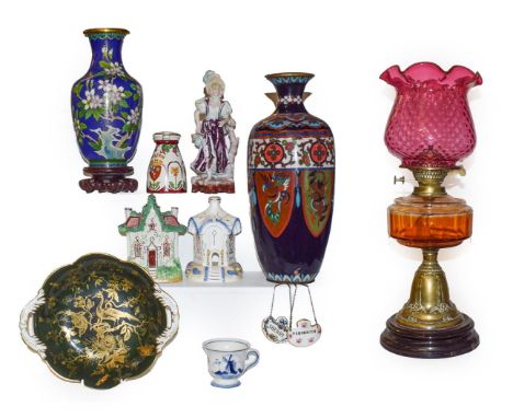 Assorted decorative items including two cloisonne vases one mounted as a lamp, a Victorian brass oil lamp with cranberry glas
