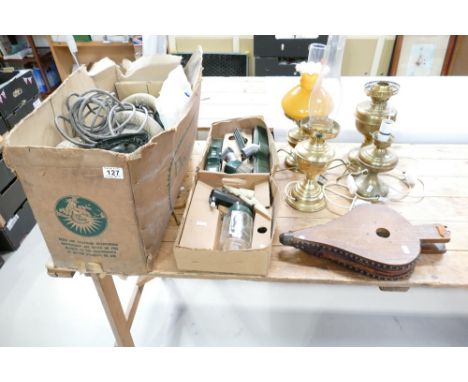 A mixed collection of items to include a vintage Electrolux Hoover with attachments, wooden bellows and four modified oil lam