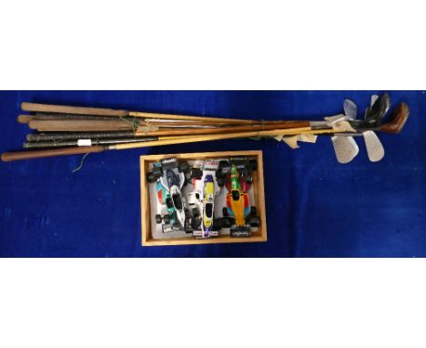A mixed collection of items to include F1 model cars, Hickory and Steel shafted vintage golf clubs etc 