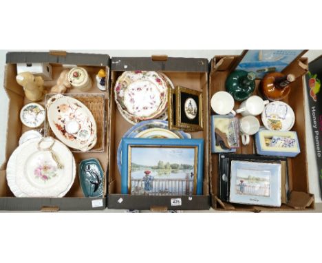 A mixed collection of ceramic items to include commemorative plates, Poole pin dishes, Sylvac dog figures, plaques and whisky