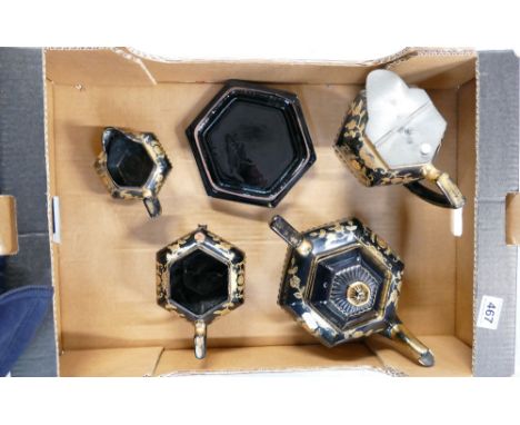 A part tea service in a black and floral gilt design to include tea pot, pouring jugs, etc.  