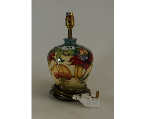 Moorcroft lamp decorated in the Queens choice design on wood plinth with original shade, height 19cm pottery only