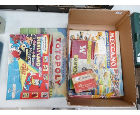 A collection of 20th Century games to include, The Great Race Game, Totopoly, Disney land give a show projector, Meccanno air