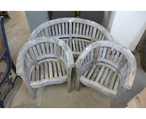 A child's teak three piece bench set