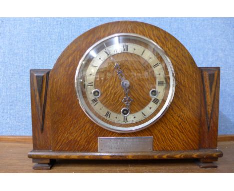 An early 20th Century oak Whittington chime mantel clock