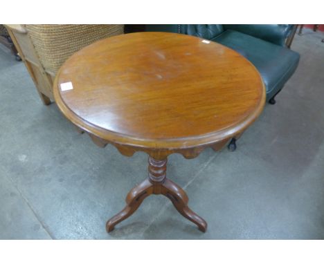 A Victorian walnut circular tripod table