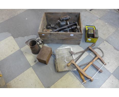A wooden advertising crate containing vintage tools, etc.