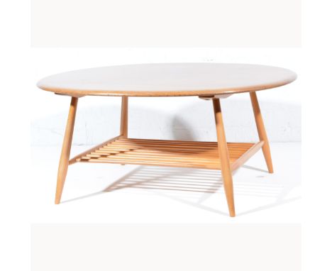 Ercol beech coffee table, oval top, spindle shelf under.