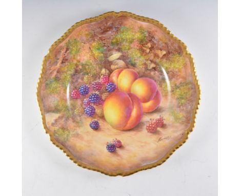 A Royal Worcester plate, wavy rim, painted number C55, painted with fruit by John Freeman, signed, diameter 27cm.
