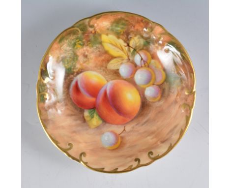 A Royal Worcester circular dish, wavy rim, painted with fruit,  signed Roberts, 11cm.