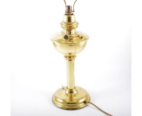 Brass oil lamp, converted to a table lamp, circular base complete with shade, 68cm.