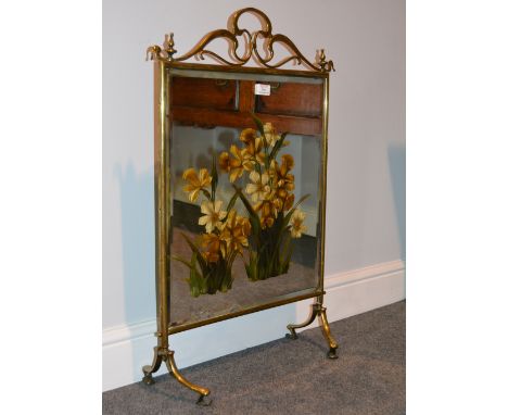 Late Victorian brass fire screen, bevelled mirror panel, painted with daffodils, height 79cm.