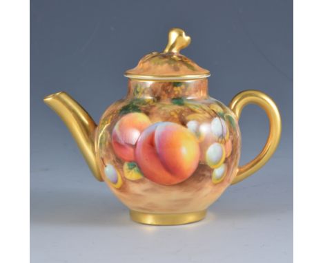 A Royal Worcester miniature teapot and cover, painted with fruit,  signed Roberts, 9cm.