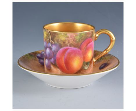 A Royal Worcester coffee can and saucer, both date mark for 1959, painted with fruit by John Freeman, signed, the saucer diam