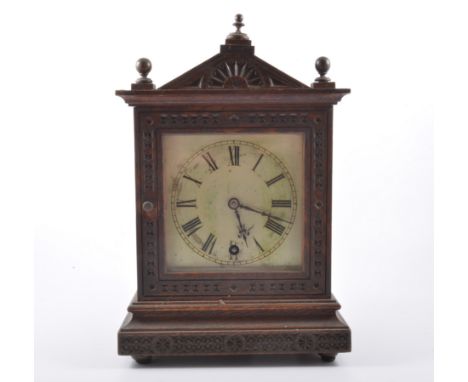 Oak case mantel clock, probably German, late 19th Century, carved decoration, triangular pediment, silvered dial, spring driv