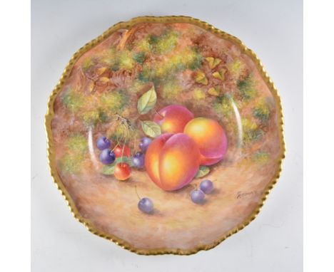 A Royal Worcester plate, painted number C55, painted with fuit by John Freeman, signed, diameter 27cm.