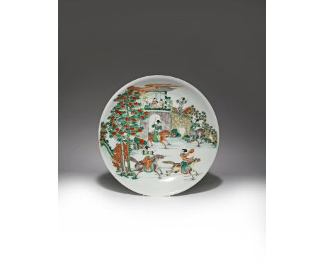 A LARGE CHINESE FAMILLE VERTE DISH 19TH CENTURY Brightly painted with ladies riding on horseback as three gentlemen drink tea