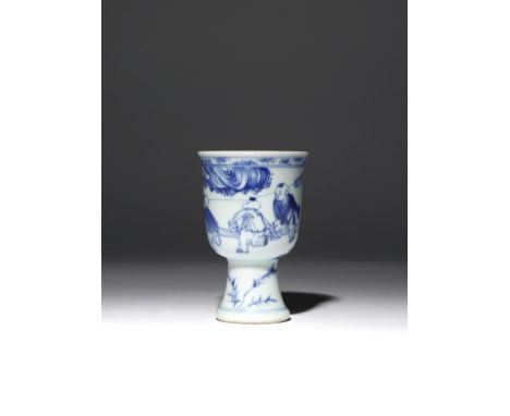 A SMALL CHINESE BLUE AND WHITE STEM CUP TRANSITIONAL C.1640 The deep U-shaped body raised on a tall flared foot, decorated wi