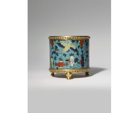 A CHINESE CLOISONNE 'CRANES' INCENSE BURNER MING DYNASTY The cylindrical body decorated with four cranes in flight amidst sty