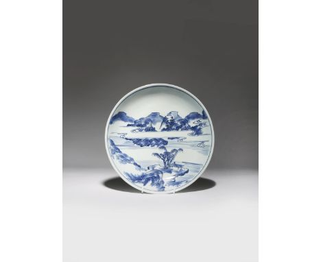 A CHINESE BLUE AND WHITE 'MASTER OF THE ROCKS' DISH KANGXI 1662-1722 Painted in underglaze blue with a landscape scene contai