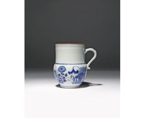 A SMALL CHINESE BLUE AND WHITE 'FOUR SEASONS' MUG KANGXI 1662-1722 Painted with peony, chrysanthemum, lotus and prunus, one s
