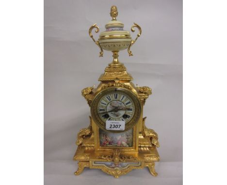 19th Century French ormolu and porcelain mounted mantel clock, the ornate case with an urn surmount and applied with porcelai