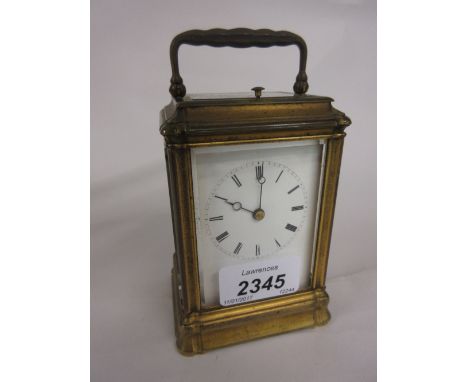 Small late 19th or early 20th Century gilt brass carriage clock, the Gorge case enclosing and enamel dial with Roman numerals