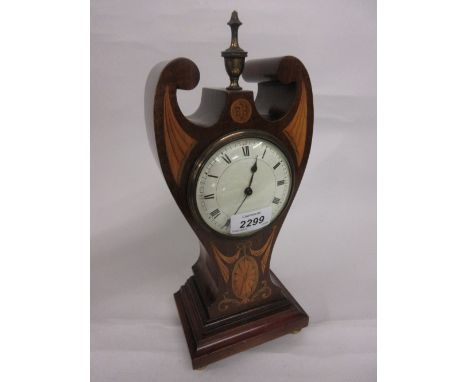 Art Nouveau mahogany and marquetry inlaid mantel timepiece, the shaped case with a brass finial surmount of stylised waisted 