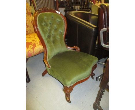 Victorian carved walnut and button upholstered low seat nursing chair