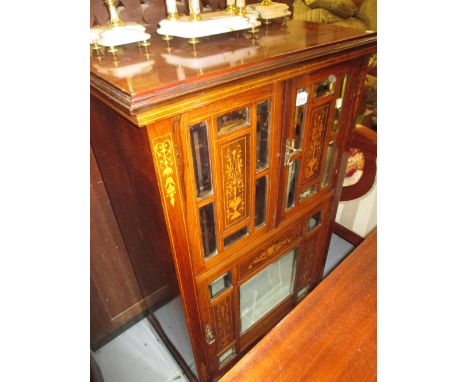 Edwardian rosewood marquetry inlaid music cabinet with two mirror inset doors above a single large door, raised on bracket su