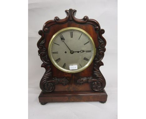 William IV mahogany bracket clock, the shaped case with applied carved floral decoration, the circular silvered dial with Rom