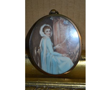 Oval watercolour miniature portrait of a lady with a spinning wheel