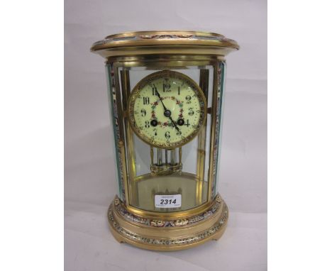 Late 19th or early 20th Century French gilt brass and champleve enamel oval four glass library clock, the enamel dial with Ar
