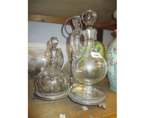 Group of three various glass decanters mounted on a plated stand, together with a modern glass punch bowl with ladle