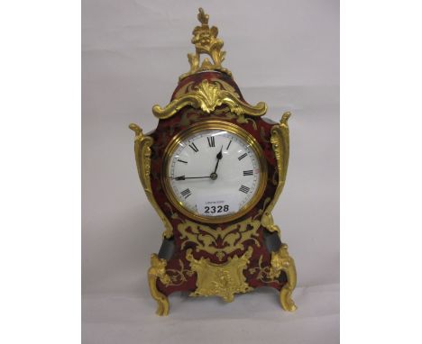 Small late 19th or early 20th Century French buhl mantel clock, the ormolu mounted waisted case enclosing an enamel dial with