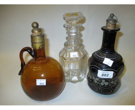 Bohemian blue glass and white enamel decorated decanter together with two other decanters