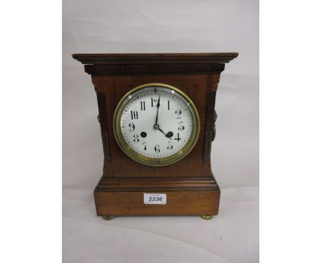 Edwardian mahogany mantel clock, the circular enamel dial with Arabic numerals and two train movement