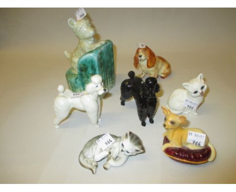 Beswick figure of a chihuahua seated on a cushion, two figures of poodles and two figures of cats together with a Beswick war