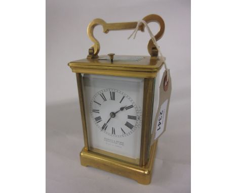 Small late 19th or early 20th Century brass cased carriage clock, the enamel dial with Roman numerals, signed Perrett and Joy