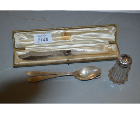 Cased silver and mother of pearl butter knife, silver spoon and fork and a silver mounted pepper