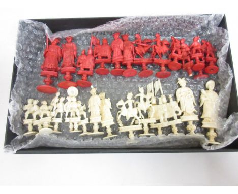 19th Century Chinese natural and red stained carved ivory chess set, the King 3.75ins, pawns 2ins